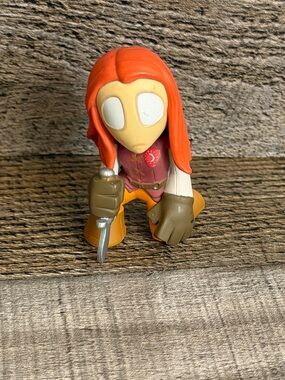 Red-Haired Vinyl Figure with Dagger